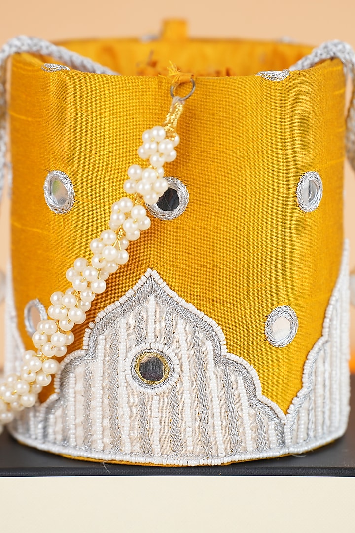 Yellow Semi-Raw Silk Potli by Feza Bags at Pernia's Pop Up Shop