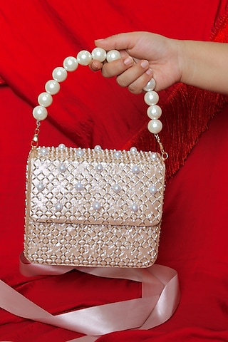 Dull hot sale gold clutch