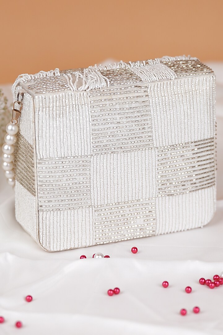 White Semi-Raw Silk Fringed Baguette Bag by Feza Bags at Pernia's Pop Up Shop