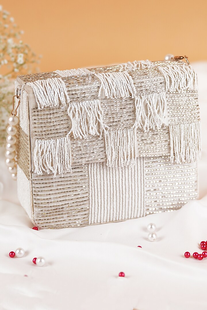 White Semi-Raw Silk Fringed Baguette Bag by Feza Bags at Pernia's Pop Up Shop