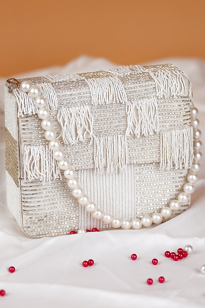 White Semi-Raw Silk Fringed Baguette Bag by Feza Bags at Pernia's Pop Up Shop