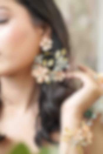 Gold Finish Orange Gemstone & Resin Floral Earrings by FLORISTAA BY MAHEK at Pernia's Pop Up Shop