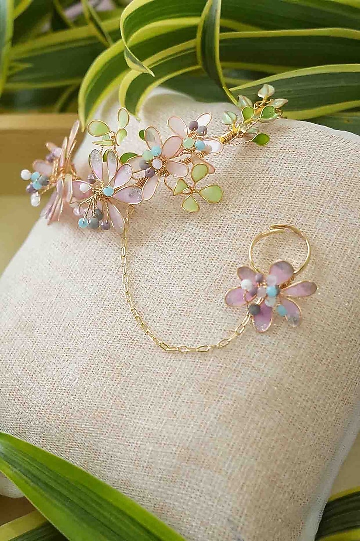 Gold Finish White Gemstone & Resin Floral Hathphool (Set of 2) by FLORISTAA BY MAHEK at Pernia's Pop Up Shop