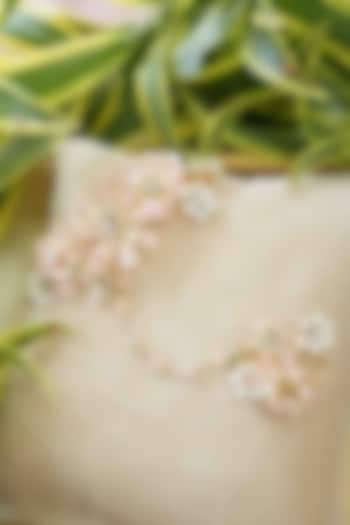 Gold Finish Off-White Gemstone & Resin Floral Hathphool (Set of 2) by FLORISTAA BY MAHEK at Pernia's Pop Up Shop