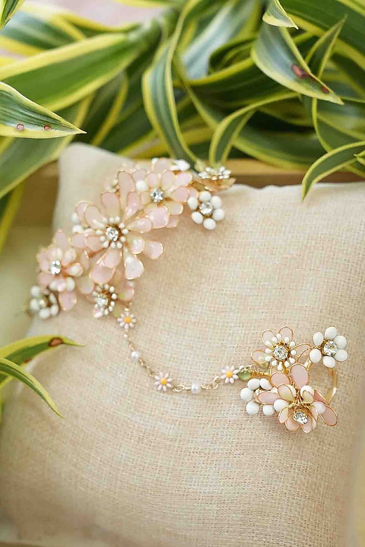 Gold Finish Off-White Gemstone & Resin Floral Hathphool (Set of 2) by FLORISTAA BY MAHEK at Pernia's Pop Up Shop