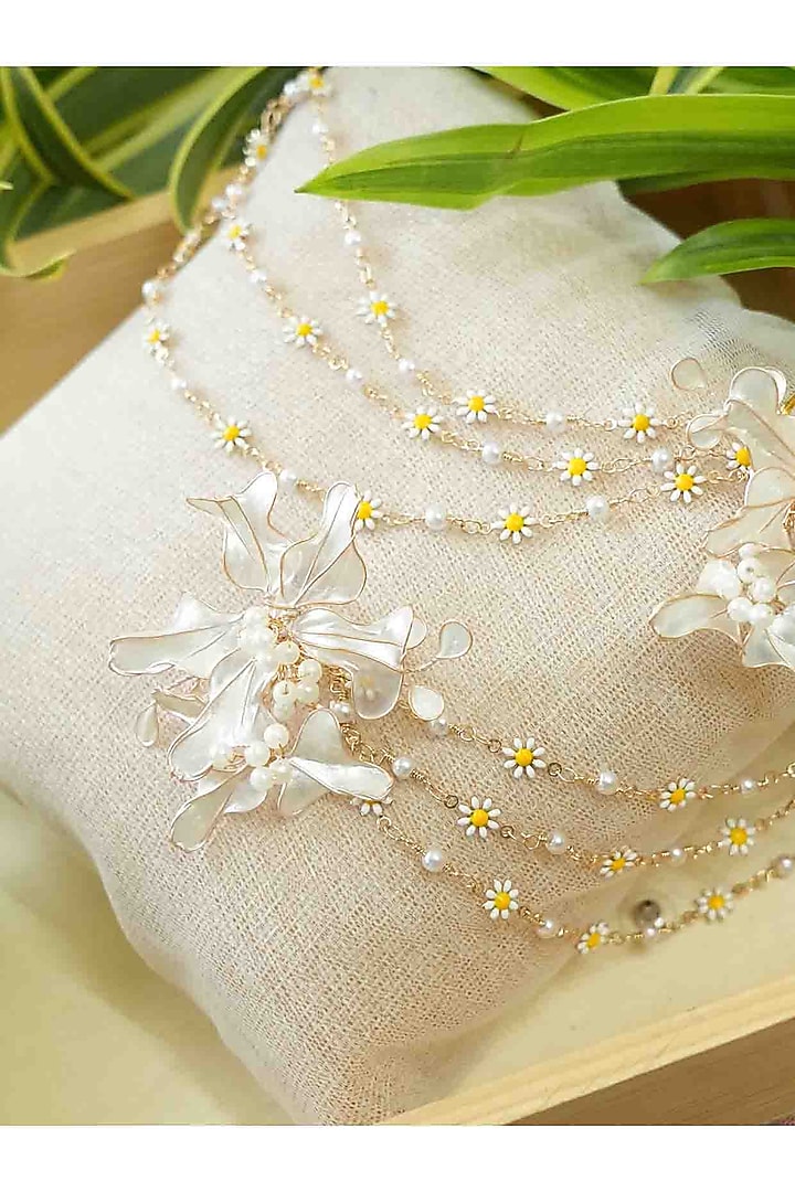 Gold Finish White Gemstone & Resin Floral Earrings by FLORISTAA BY MAHEK at Pernia's Pop Up Shop