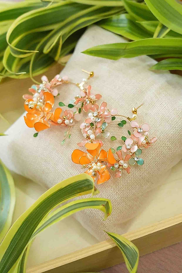 Gold Finish Orange Gemstone & Resin Floral Earrings by FLORISTAA BY MAHEK at Pernia's Pop Up Shop