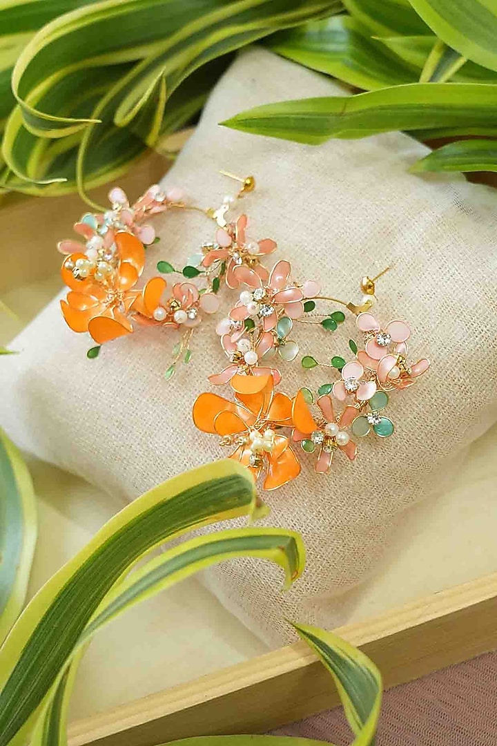 Gold Finish Orange Gemstone & Resin Floral Earrings by FLORISTAA BY MAHEK at Pernia's Pop Up Shop