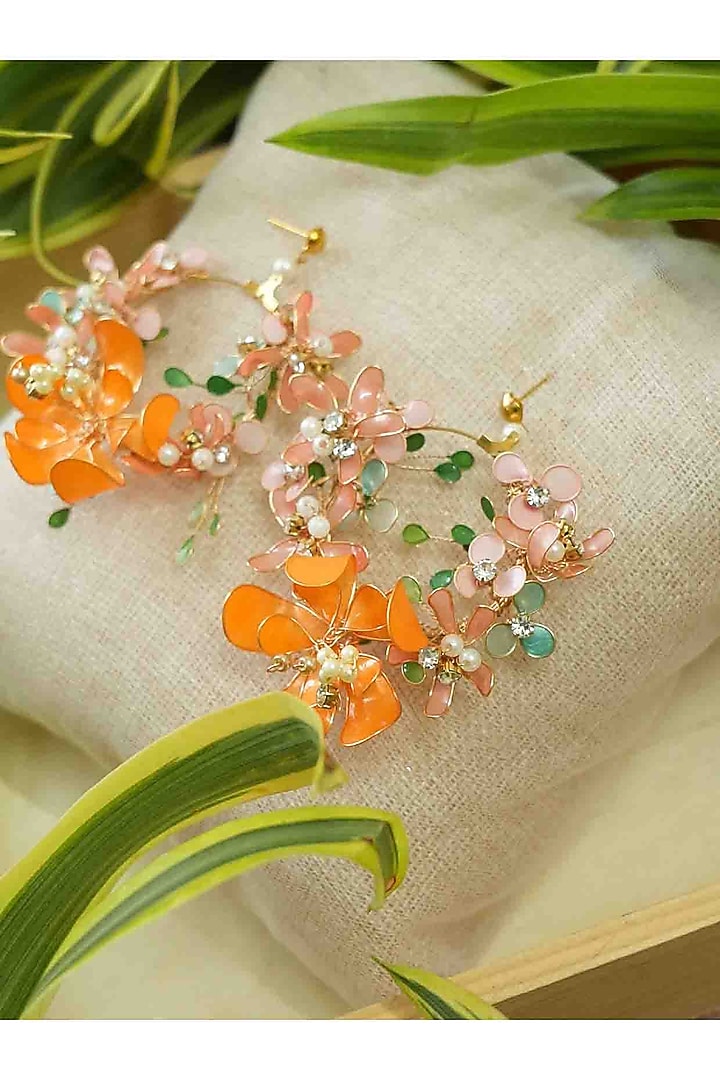 Gold Finish Orange Gemstone & Resin Floral Earrings by FLORISTAA BY MAHEK at Pernia's Pop Up Shop