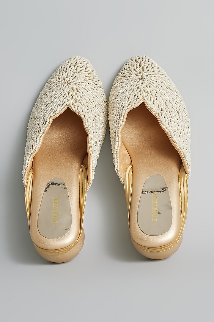 Gold Rexine Pearl & Aari Hand Embroidered Juttis by Foot Fuel