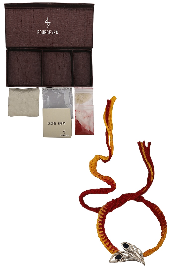 Mayura peacock feather brooch and moli thread rakhi set available only at Pernia's Pop Up Shop.