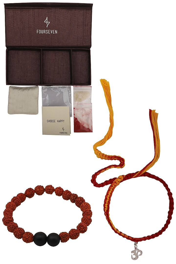 OM' charm pendant and moli thread rakhi set available only at Pernia's Pop Up Shop.