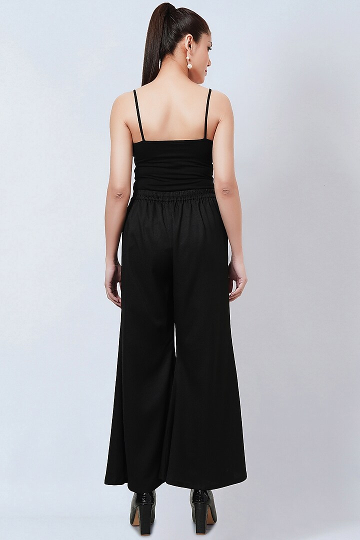Black Banana Crepe Bell Bottom Pants by First Resort by Ramola Bachchan at Pernia's Pop Up Shop
