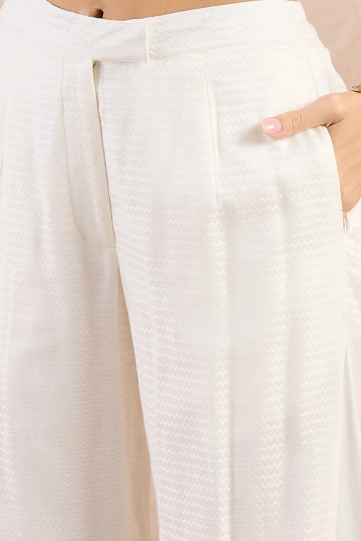 White Herringbone Flared Pants by First Resort by Ramola Bachchan at Pernia's Pop Up Shop