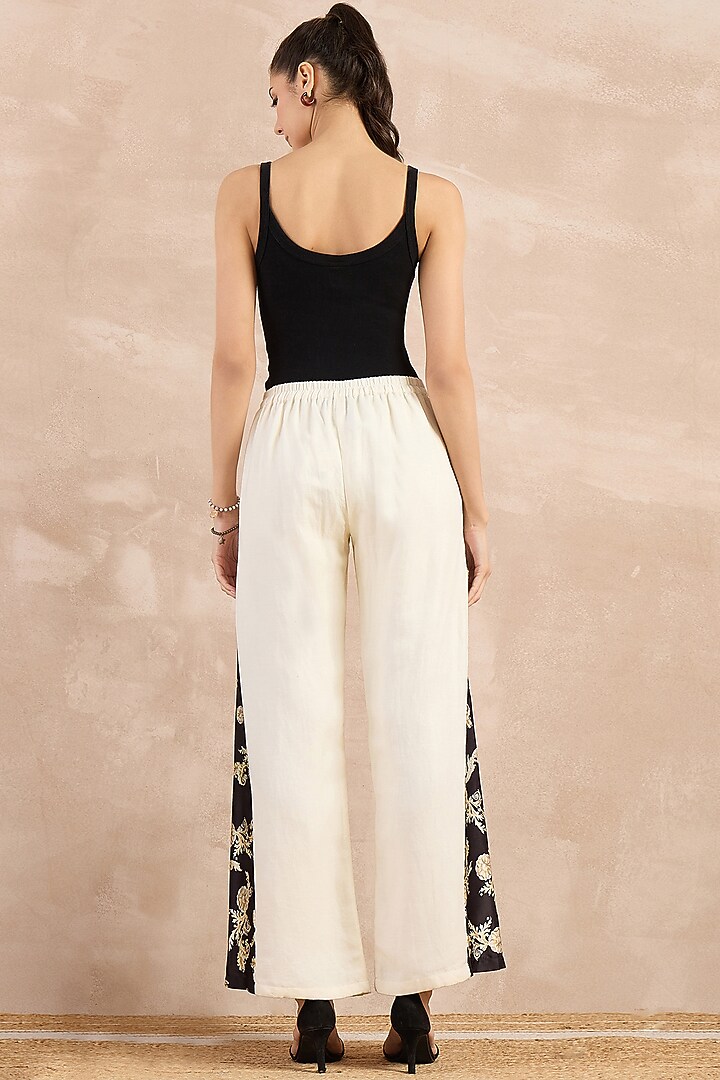 White Satin Printed Flared Pants by First Resort by Ramola Bachchan at Pernia's Pop Up Shop