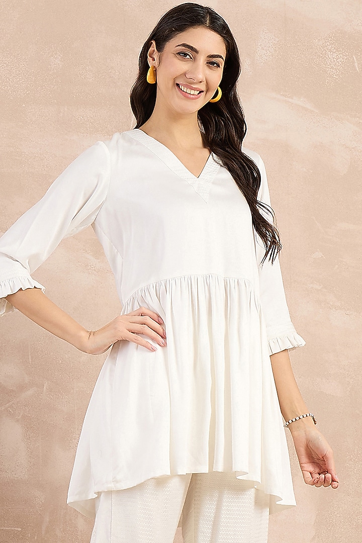 White Herringbone Frilled Peplum Top by First Resort by Ramola Bachchan at Pernia's Pop Up Shop