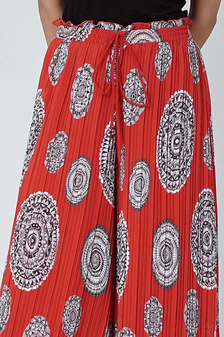 Red Geometric Printed Pleated Palazzo Pants by First Resort by Ramola Bachchan at Pernia's Pop Up Shop