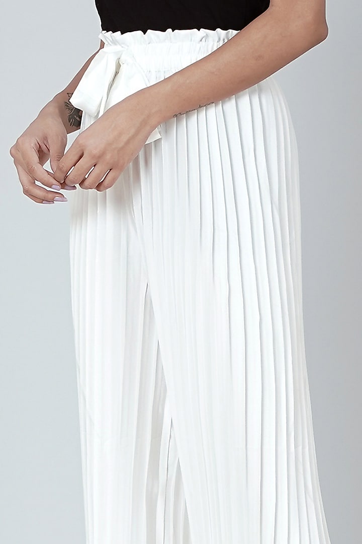 White Pleated Palazzo Pants Design by First Resort by Ramola Bachchan at  Pernia's Pop Up Shop 2024