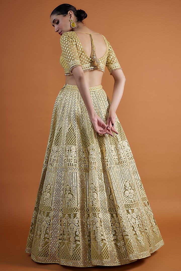 Yellow Net Embroidered Bridal Lehenga Set by Falguni Shane Peacock at Pernia's Pop Up Shop