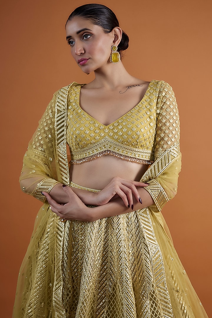 Yellow Net Embroidered Bridal Lehenga Set by Falguni Shane Peacock at Pernia's Pop Up Shop