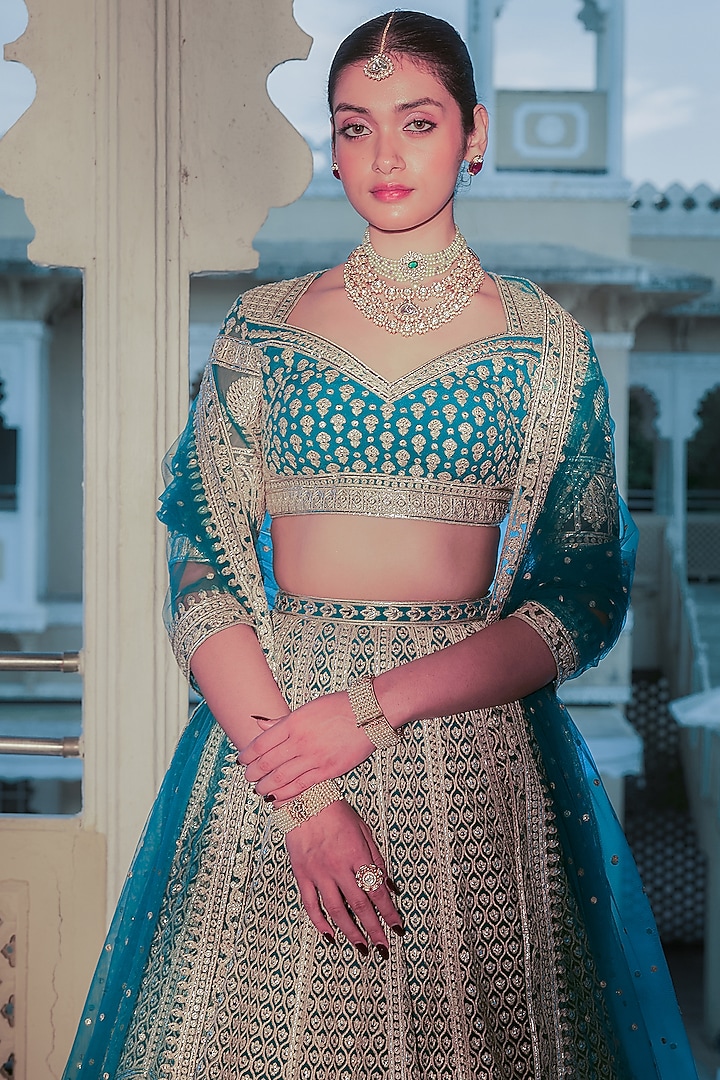 Teal Blue Net Gold Foil Printed & Embroidered Bridal Lehenga Set by Falguni Shane Peacock at Pernia's Pop Up Shop