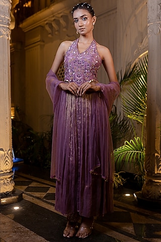 purple banarasi dress  Purple Banarasi dreams  In a rich Banarasi lehenga paired with a short  closed jacket in double matka fabric, detailed with jardoshi work that  gives a timeless royal touch. Available in-store
