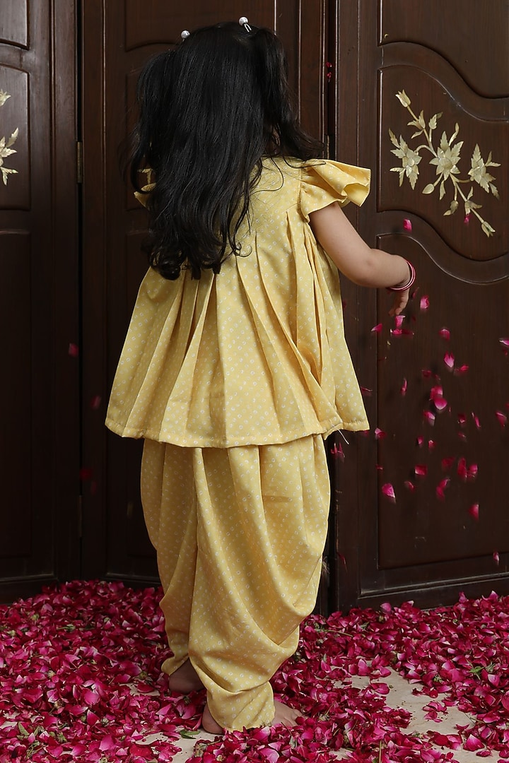 Yellow Crepe Bandhej Kurta Dhoti Set For Girls by Fayon Kids at Pernia's Pop Up Shop