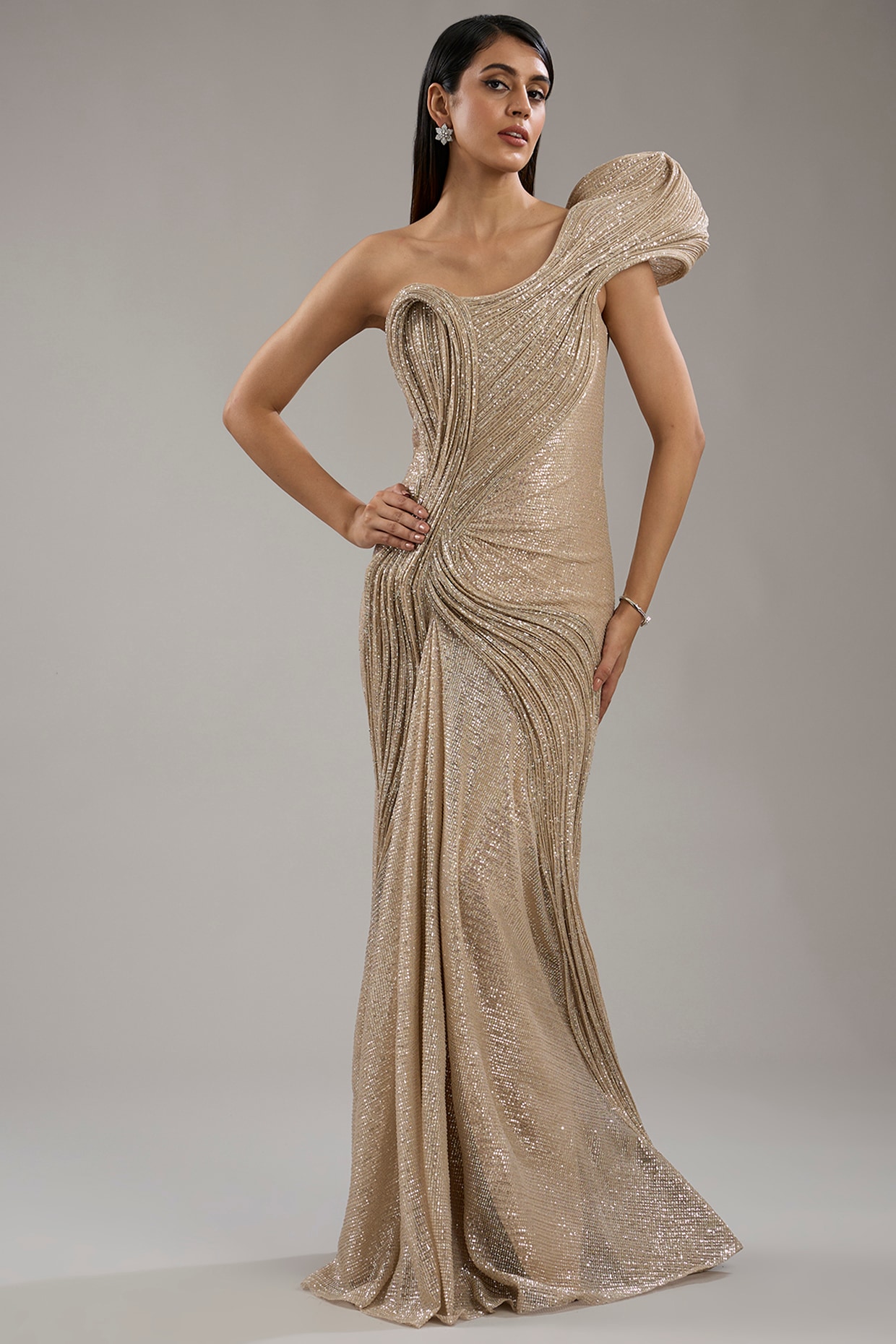 Champagne Sequinned One Shoulder Sculpted Gown by Gaurav Gupta at
