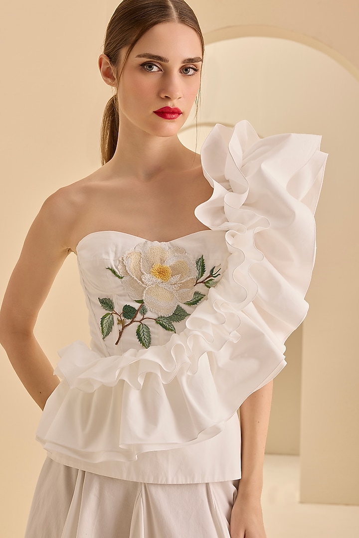 Cream Stretch Cotton Thread Embroidered One-Shoulder Ruffled Top by Gauri and Nainika at Pernia's Pop Up Shop