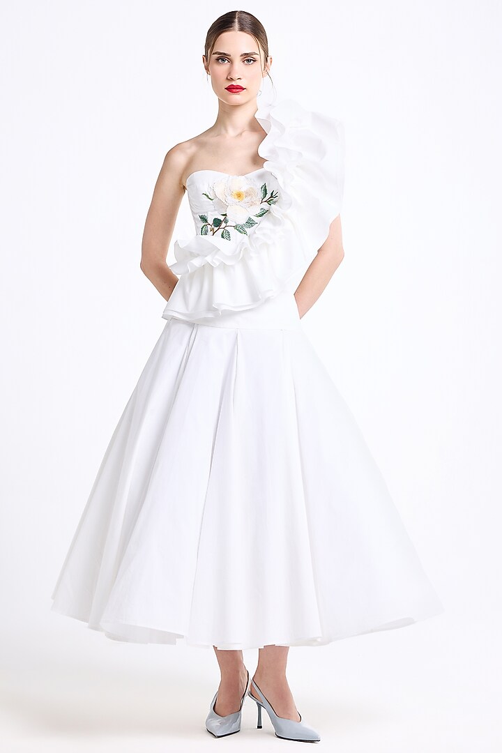 Cream Stretch Cotton Thread Embroidered One-Shoulder Ruffled Top by Gauri and Nainika at Pernia's Pop Up Shop