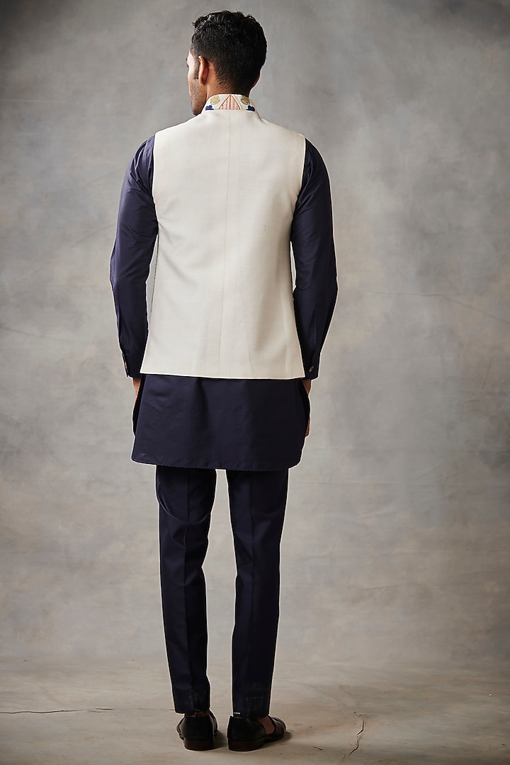White Slub Silk Machine Embroidered Bundi Jacket Set by Gargee Designers at Pernia's Pop Up Shop