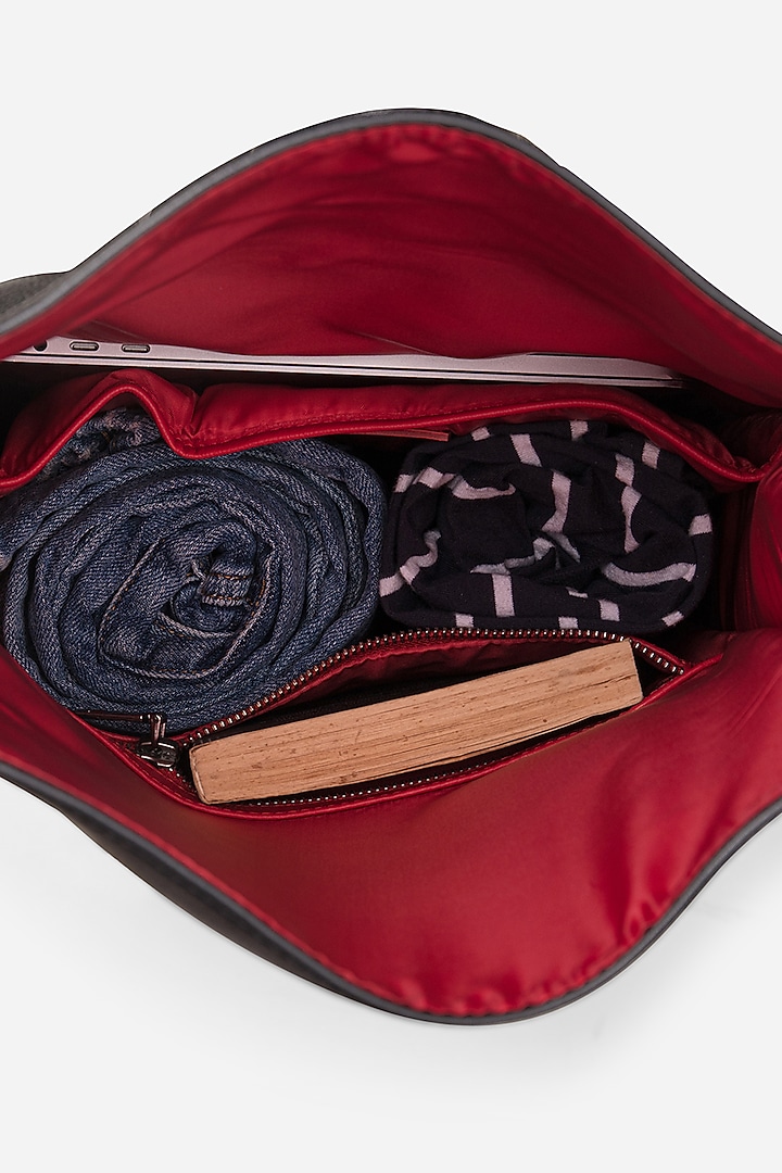 Carbon Black Leather Rolltop Backpack by GARRTEN at Pernia's Pop Up Shop