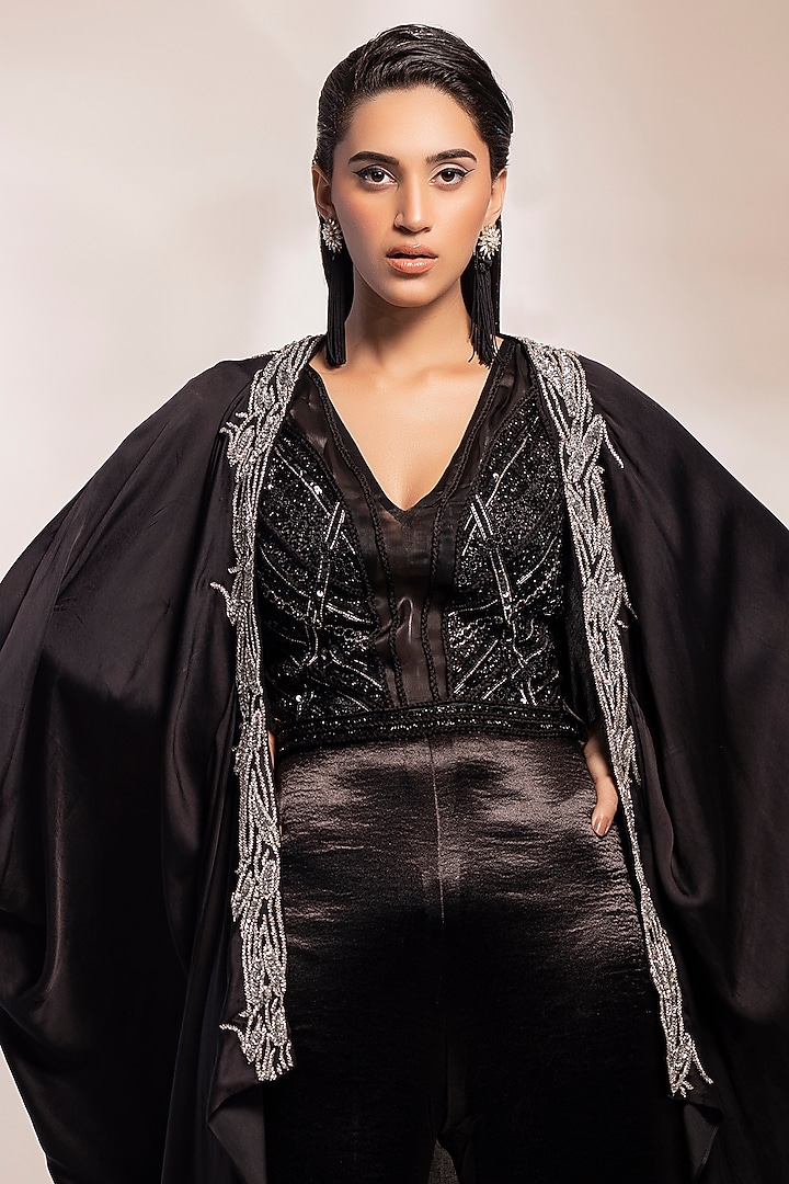 Black Satin Sequins Embroidery Jumpsuit With Cape by GEE SIN by Geetanjali Singh at Pernia's Pop Up Shop