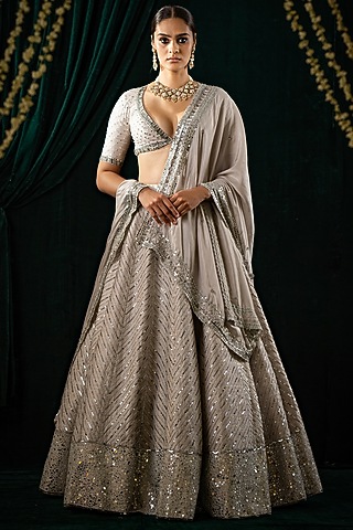 Ivory Raw Silk Embroidered Lehenga Set by Geethika Kanumilli