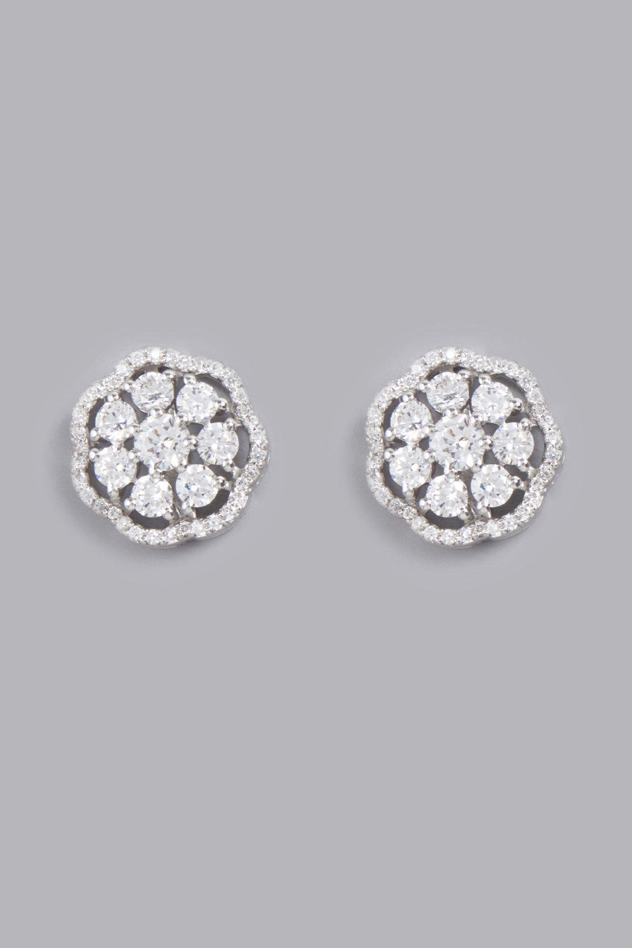 White Finish Stud Earrings With Zircons In Sterling Silver by Gemstruck at Pernia's Pop Up Shop