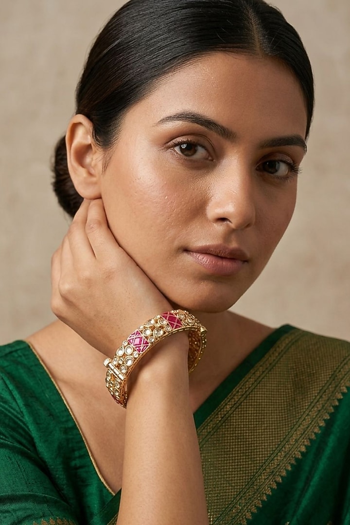 Gold Finish Kundan Polki & Red Stone Bangles (Set Of 2) by Gehna Shop at Pernia's Pop Up Shop