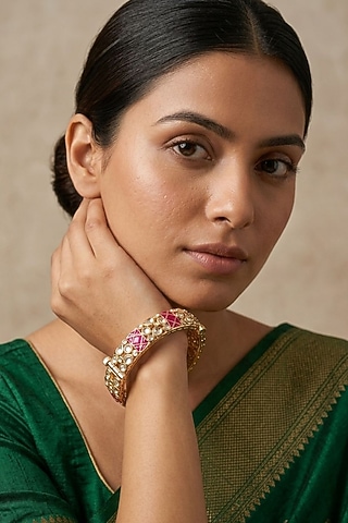 Gold Finish Kundan Polki & Red Stone Bangles (Set Of 2) by IndieBlingz