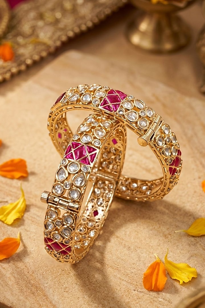 Gold Finish Kundan Polki & Red Stone Bangles (Set Of 2) by Gehna Shop at Pernia's Pop Up Shop