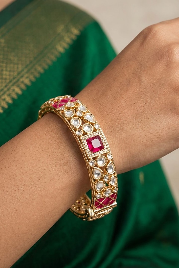Gold Finish Kundan Polki & Red Stone Bangles (Set Of 2) by Gehna Shop at Pernia's Pop Up Shop