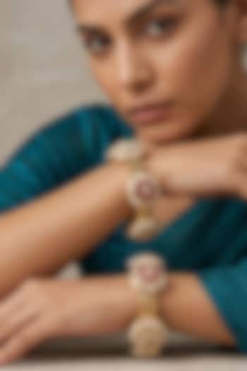 Gold Finish Kundan Polki & Red Stone Bangles (Set Of 2) by Gehna Shop at Pernia's Pop Up Shop