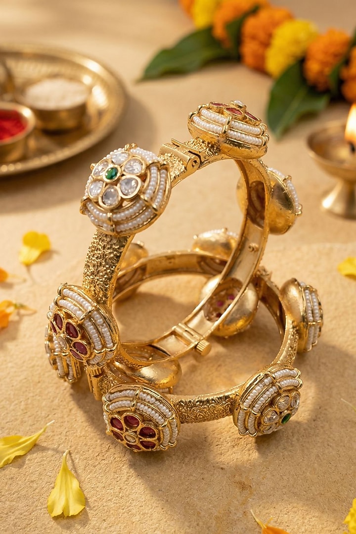Gold Finish Kundan Polki & Red Stone Bangles (Set Of 2) by Gehna Shop at Pernia's Pop Up Shop