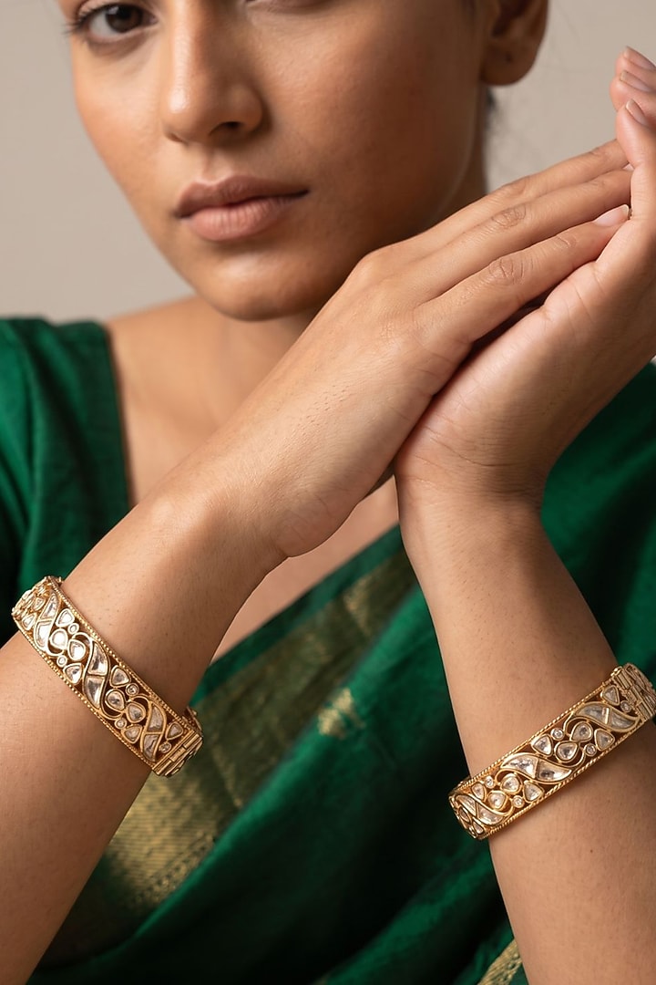 Gold Finish Red Kundan Polki Bangles (Set Of 2) by Gehna Shop at Pernia's Pop Up Shop