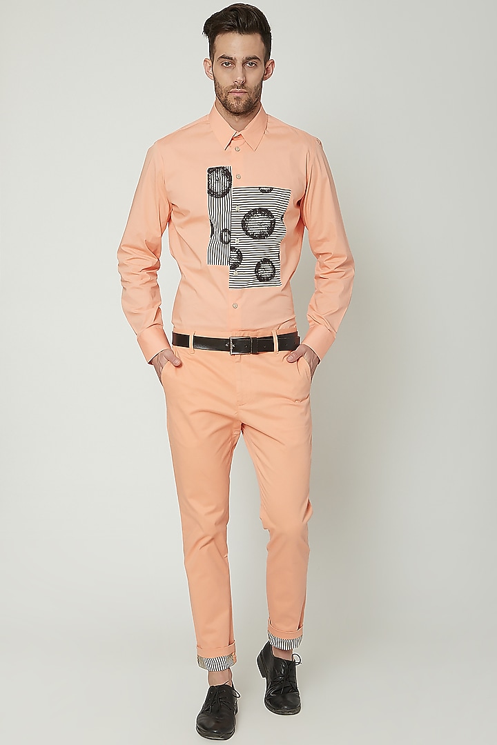 Salmon Pink Chino Trousers by Genes Lecoanet Hemant Men