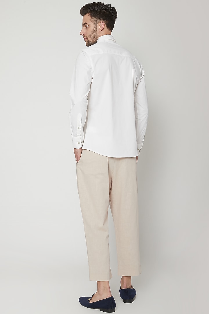 Natural Beige Pleated Trousers by Genes Lecoanet Hemant Men at Pernia's Pop Up Shop
