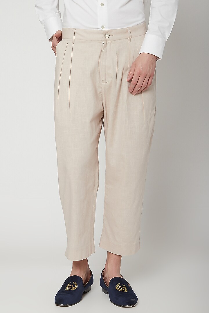 Natural Beige Pleated Trousers by Genes Lecoanet Hemant Men at Pernia's Pop Up Shop