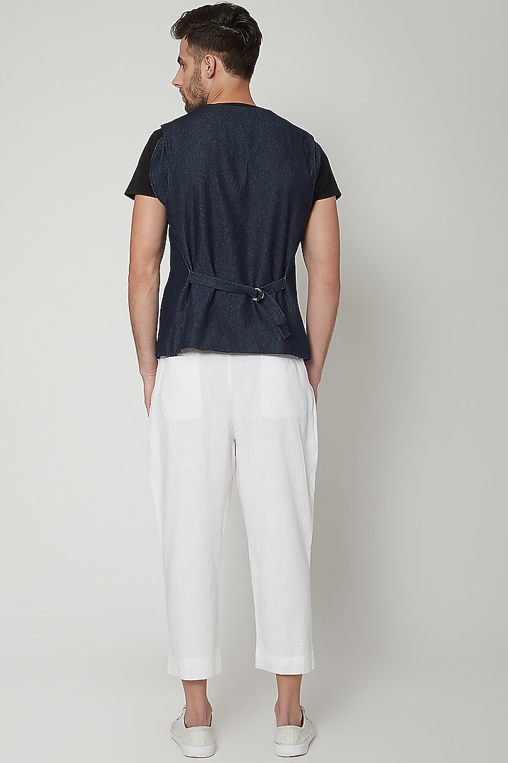 White Pleated Trousers by Genes Lecoanet Hemant Men at Pernia's Pop Up Shop