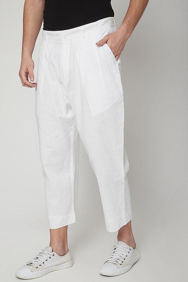 White Pleated Trousers by Genes Lecoanet Hemant Men at Pernia's Pop Up Shop