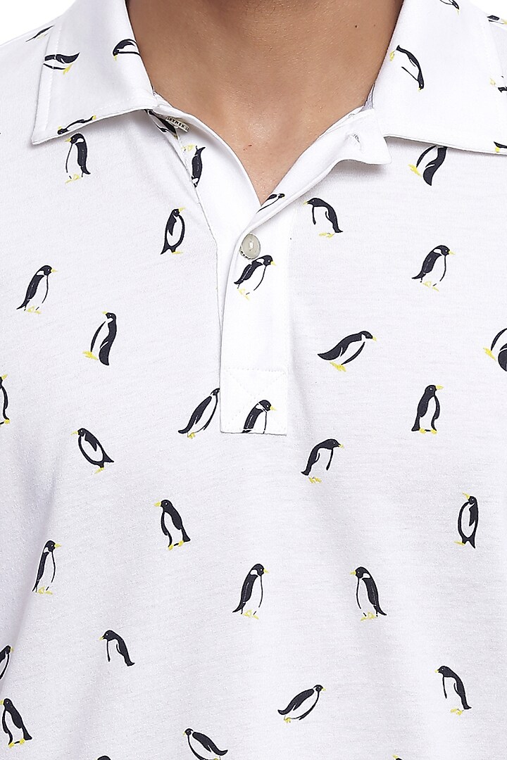 White Printed Polo T-Shirt by Genes Lecoanet Hemant Men at Pernia's Pop Up Shop