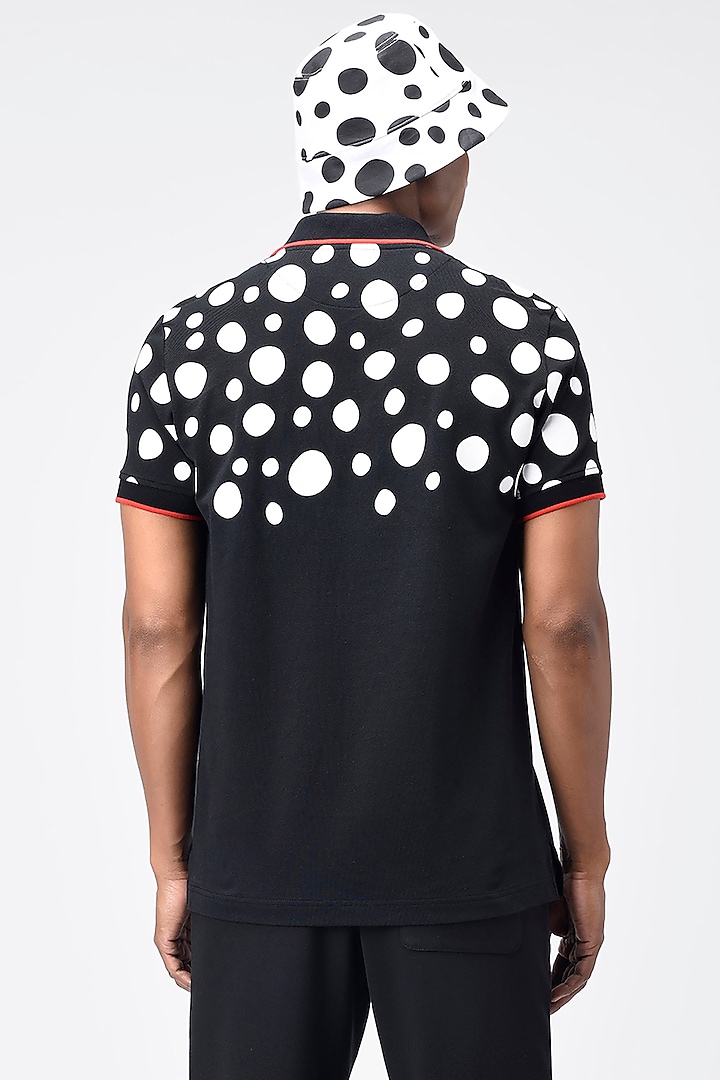 Black Printed Polo T-Shirt by Genes Lecoanet Hemant Men at Pernia's Pop Up Shop