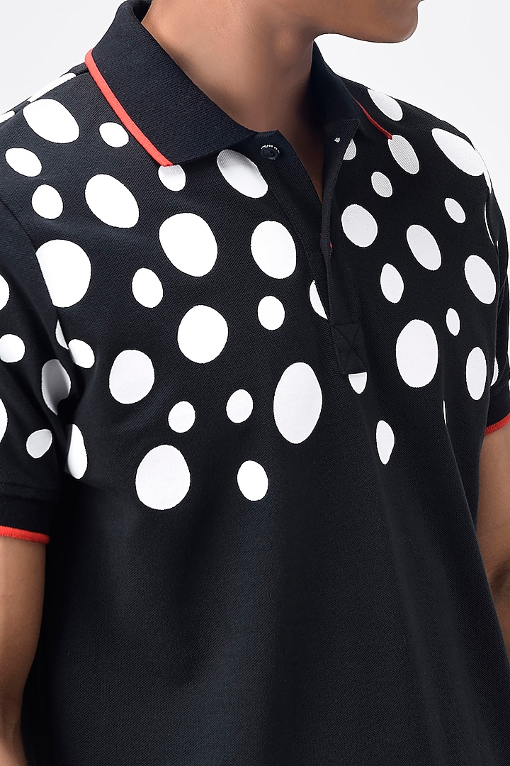Black Printed Polo T-Shirt by Genes Lecoanet Hemant Men at Pernia's Pop Up Shop
